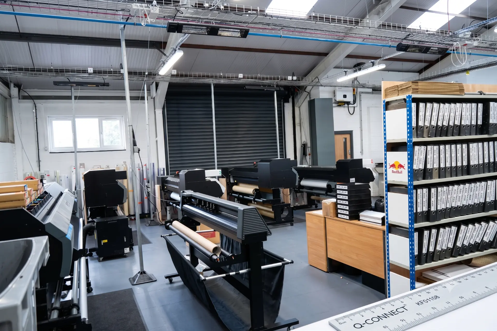 ILN print room with wide format UV printers and material rolls